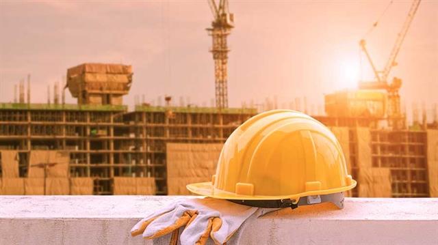 yellow hard hat on construction site